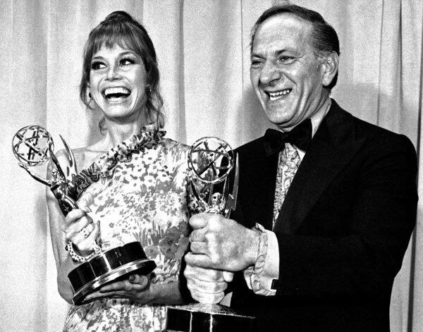 Mary Tyler Moore and Jack Klugman hold the Emmys they won in 1973 for best actress and actor in a comedy series. Moore won for "The Mary Tyler Moore Show" and Klugman for "The Odd Couple."
