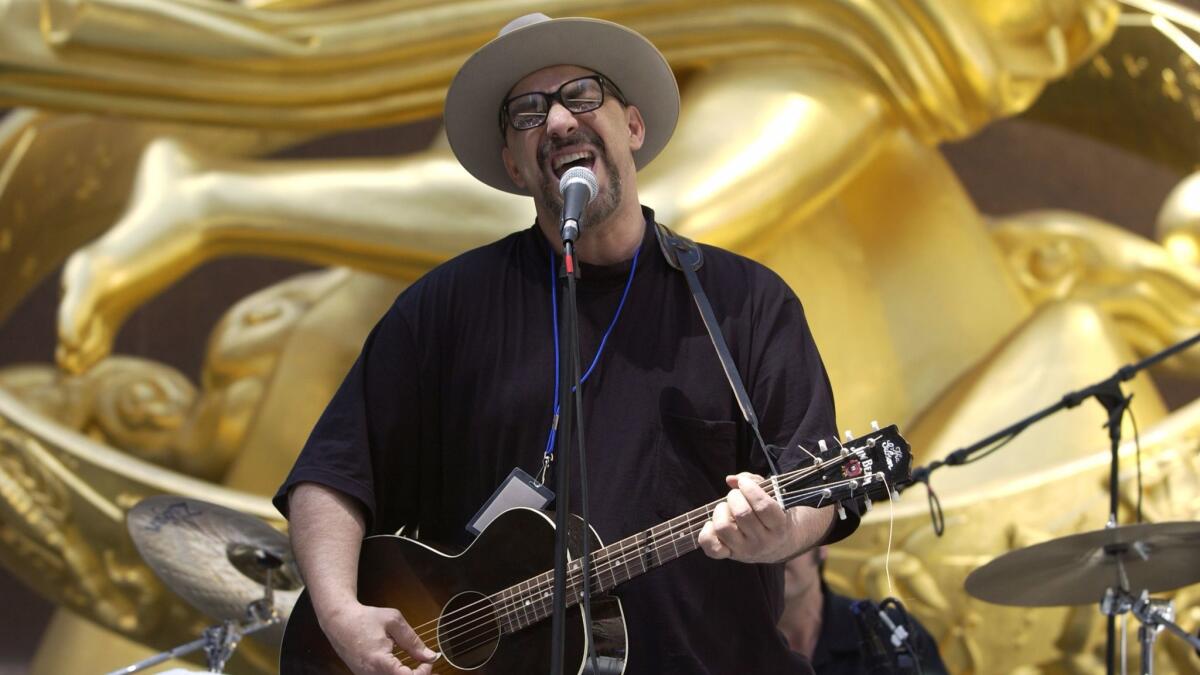 Pat DiNizio of The Smithereens sings during the USA Tennis Rock & Rally on April 28, 2003, at Rockefeller Center in New York City.