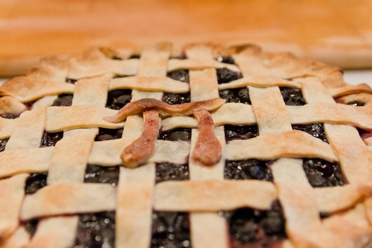 Homemade pie with pastry with a pi symbol.