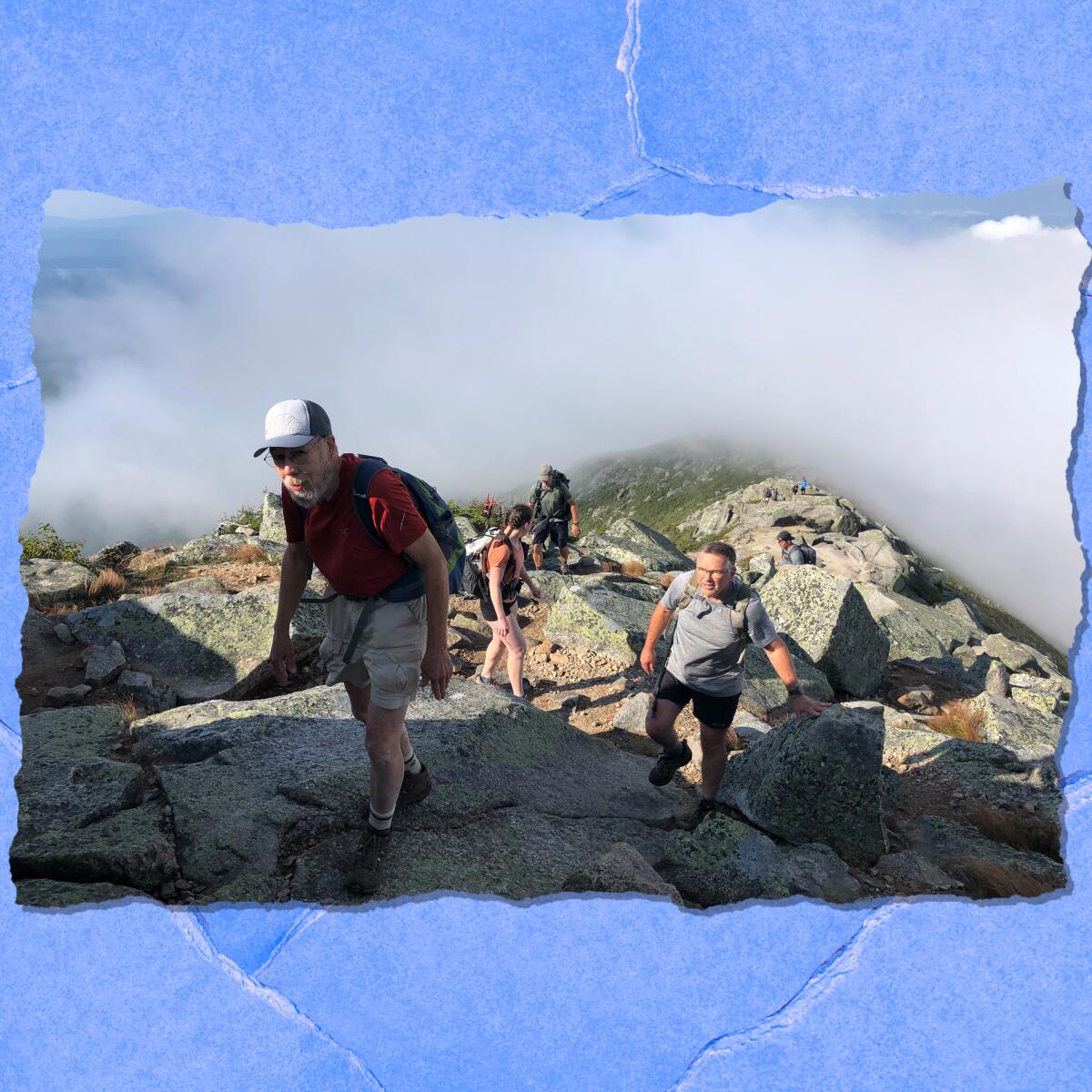 People hiking up an incline.