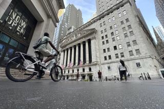 A bike rider approaches the New York Stock Exchange, rear, on Tuesday, July 9, 2024, in New York. Global shares are mostly higher, with Japan's benchmark Nikkei 225 jumping 2% to finish at another record high. (AP Photo/Peter Morgan)
