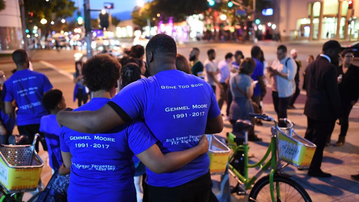 Friends, family and supporters gather for a candlelight vigil outside the West Hollywood sheriff's station in support of Gemmel Moore, who was found dead of a drug overdose in the home of prominent Democratic donor Ed Buck.