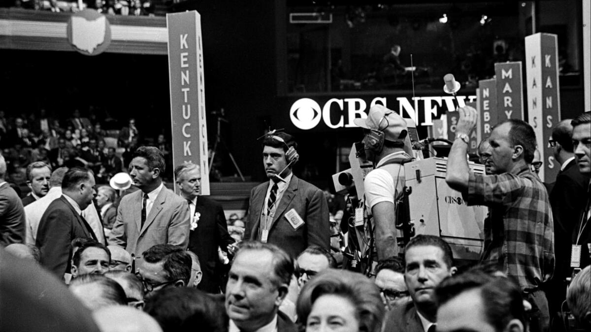 Dan Rather, center, at the Democratic National Convention in 1968. He was punched in the stomach there by security, in a scuffle caught on camera.