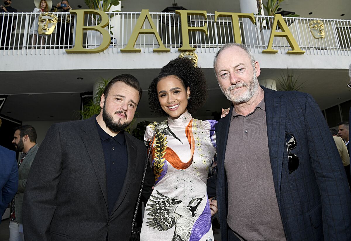 John Bradley, left, Nathalie Emmanuel and Liam Cunningham at the BAFTA Los Angeles + BBC America TV Tea Party.