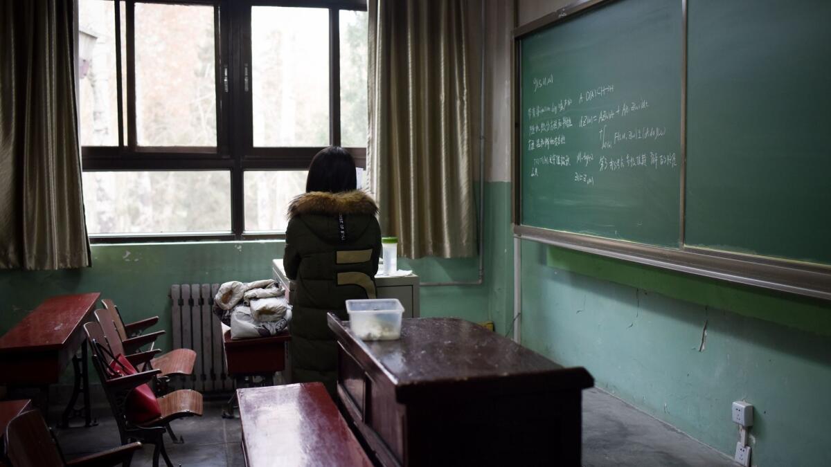 A female student in a classroom at Beijing's Beihang University, where the vice director of the graduate school was stripped of his position after an investigation determined that he had sexually harassed multiple students.