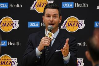 Lakers coach JJ Redick fields questions during his introductory news conference.