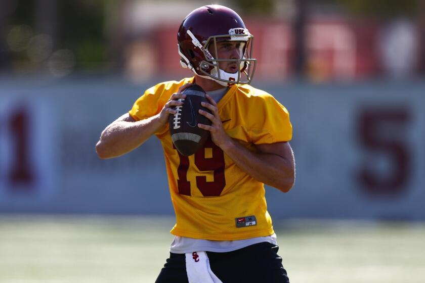 LOS ANGELES, CALIF. - AUGUST 03: USC Trojans quarterback Matt Fink (19) passes during drills as the USC Trojans open up the first day of Fall Camp at the USC Football Practice Field on Friday, Aug. 3, 2018 in Los Angeles, Calif. (Kent Nishimura / Los Angeles Times)