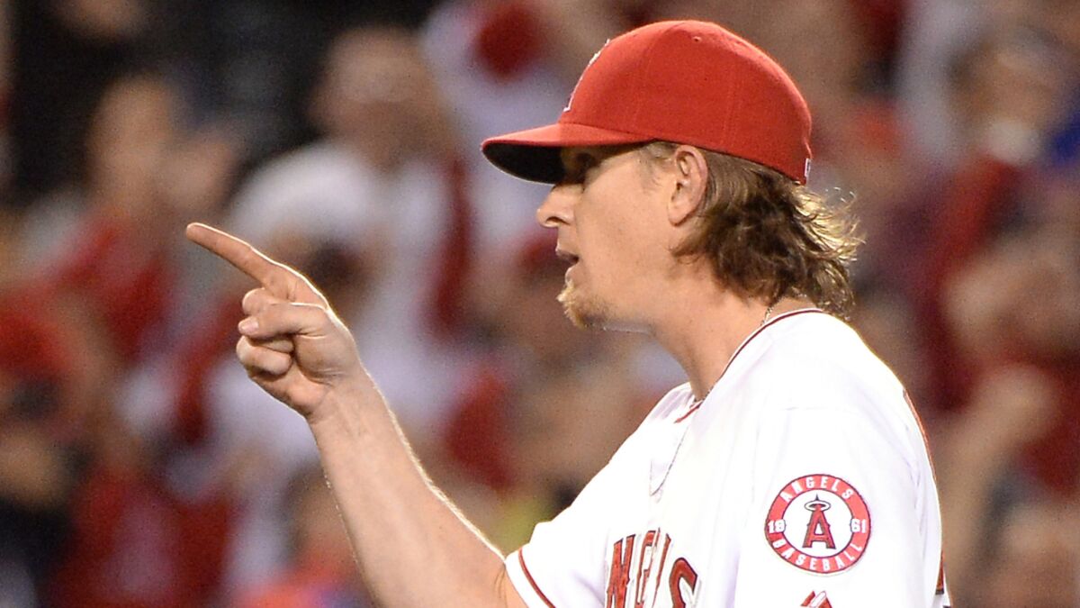 Jered Weaver reacts after pitching a complete game in a 2-1 win over the Houston Astros at Angel Stadium on Wednesday.