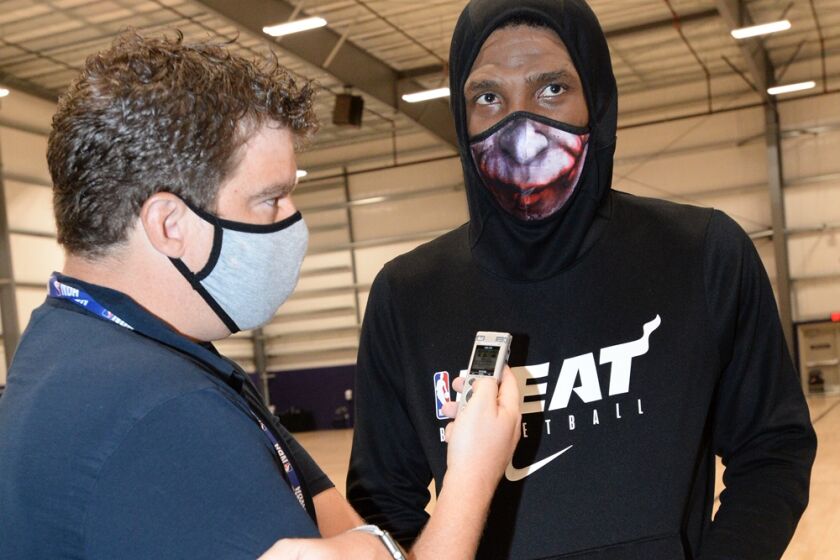 Times reporter Dan Woike interviews Heat star Jimmy Butler during a practice.