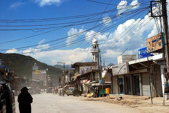 A view of a street of Sawari village, in the Buner district of Pakistan. The nation's government dispatched a small paramilitary force to the district on Thursday after Taliban forces took control of much of the area this week.