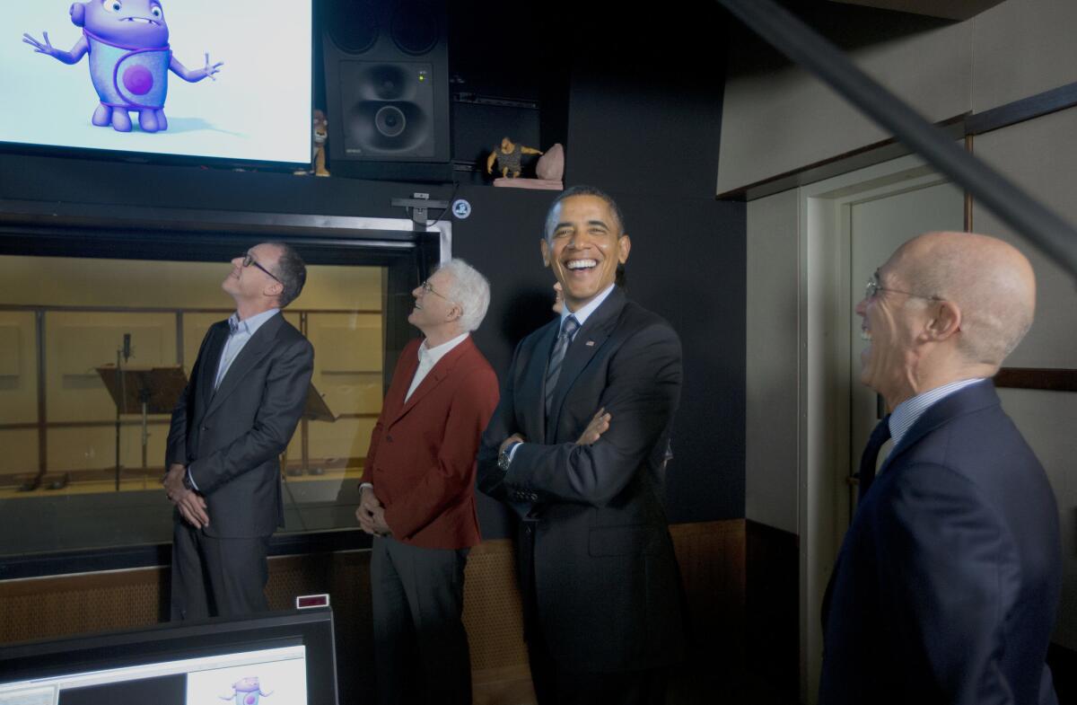 President Obama reacts to hearing his remarks used as the voice for an animated character during a tour of the recording studio at DreamWorks Animation studios in Glendale on Tuesday.