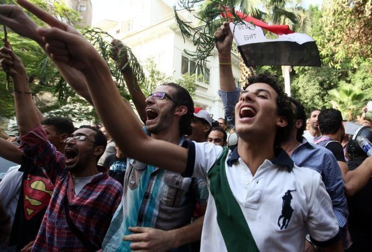 Egyptian protesters chant slogans outside the culture ministry headquarters in Cairo on June 11. Artists complain that the new culture minister, Alaa Abdel-Aziz, is trying to impose an Islamist agenda and restrict artistic freedom.