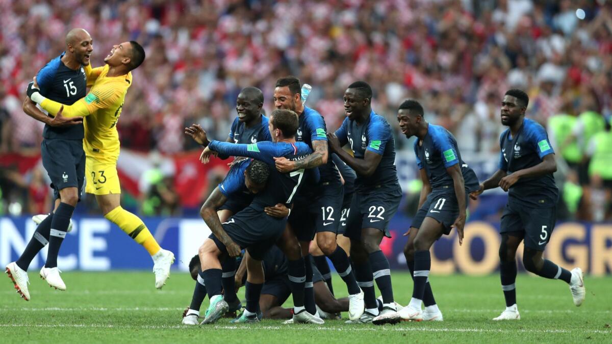 France players celebrate following their 4-2 victory over Croatia in the World Cup final on July 15.