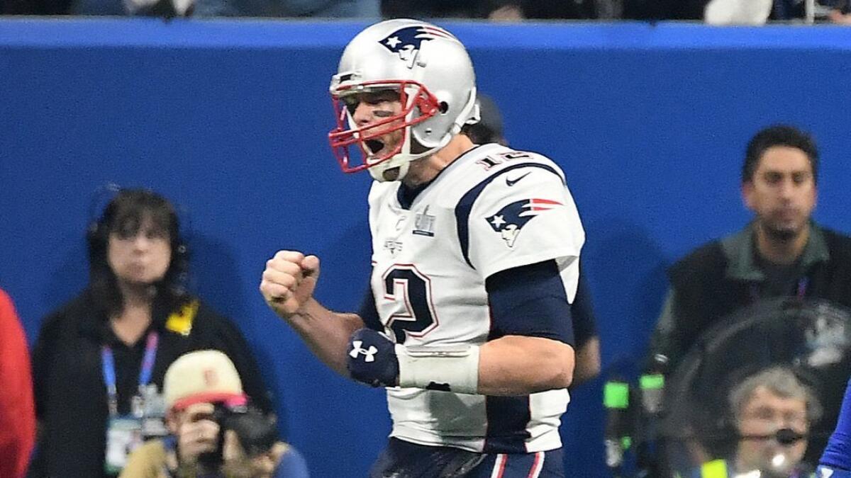Patriots quarterback Tom Brady celebrates after a touchdown by Sony Michel in the fourth quarter.