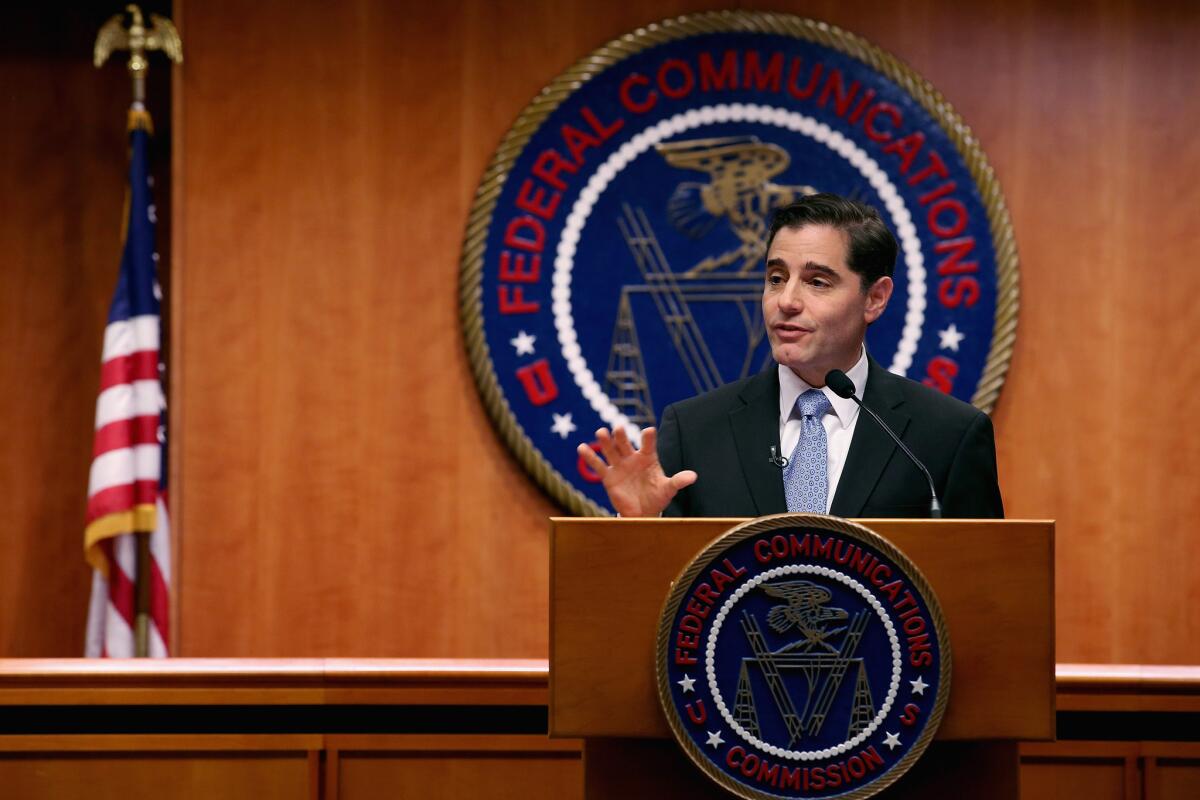 A photo of then-Federal Communications Commission Chairman Julius Genachowski announcing his plan last March to step down after one four-year term. Genachowski led the commission's effort to adopt the Net neutrality rules that a federal appeals court largely rejected on Tuesday.