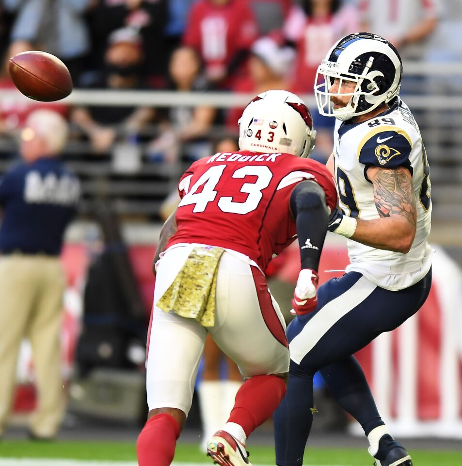 Rams tight end Tyler Higbee catches a touchdown pass in front of Cardinals linebacker Haason Reddick.
