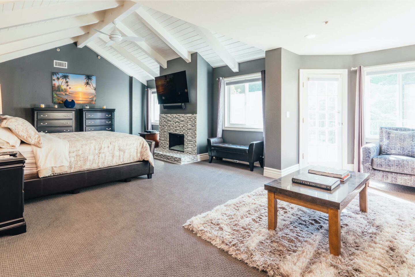 White beamed ceilings, big windows and a sitting room in the master suite.