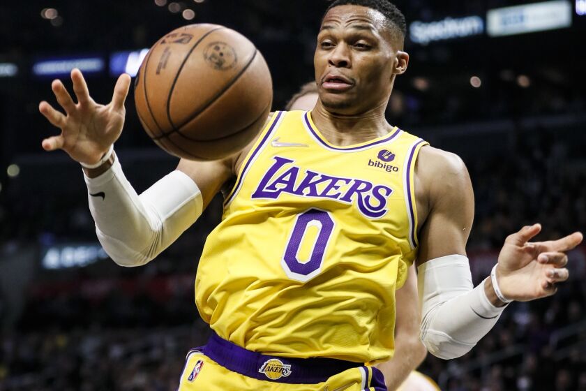 Los Angeles, CA - March 03: Los Angeles Lakers guard Russell Westbrook (0) reaches for the loose ball during the second half against the LA Clippers at Crypto.com on Thursday, March 3, 2022 in Los Angeles, CA.(Robert Gauthier / Los Angeles Times)