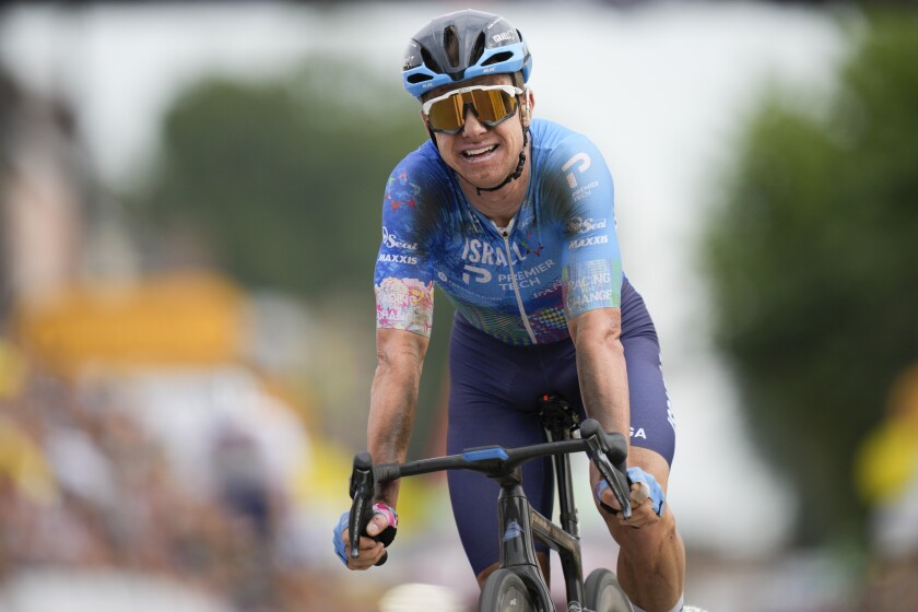 Stage winner Australia's Simon Clarke reacts after crossing the finish line of the fifth stage of the Tour de France cycling race over 157 kilometers (97.6 miles) with start in Lille Metropole and finish in Arenberg Porte du Hainaut, France, Wednesday, July 6, 2022. (AP Photo/Daniel Cole)