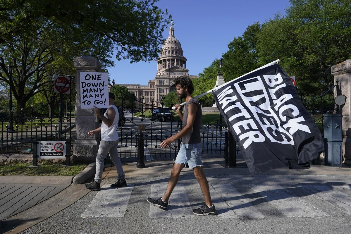 People gather at the Texas Capitol, Tuesday, April 20, 2021, in Austin, Texas, after the guilty verdict in the murder trial of former Minneapolis police Officer Derek Chauvin, in the death of George Floyd, was announced. (AP Photo/Eric Gay)