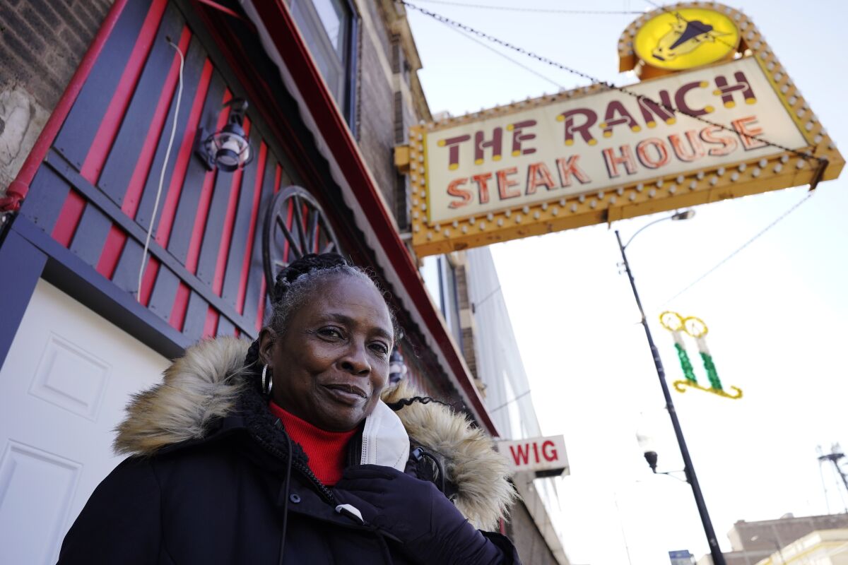 Judy Ware poses for a photo outside of her restaurant in Chicago, Thursday, Jan. 20, 2022. Judy Ware is preparing to resume table service at the Ranch after struggling through the coronavirus pandemic. A fire set during unrest following George Floyd’s killing in Minneapolis destroyed the restaurant’s interior, and takeout-only couldn't sustain the business, which has been operating for more than 50 years. (AP Photo/Nam Y. Huh)