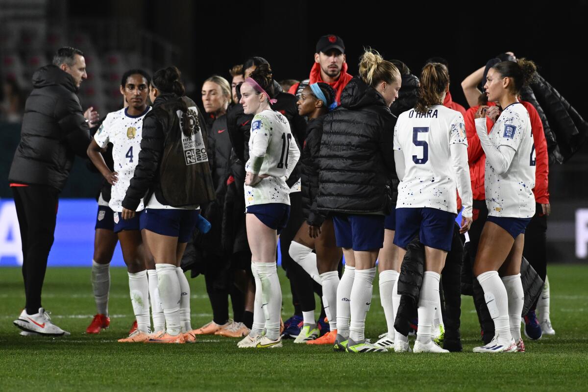 U.S. players react following a 0-0 tie against Portugal in the last match of group play on Tuesday.