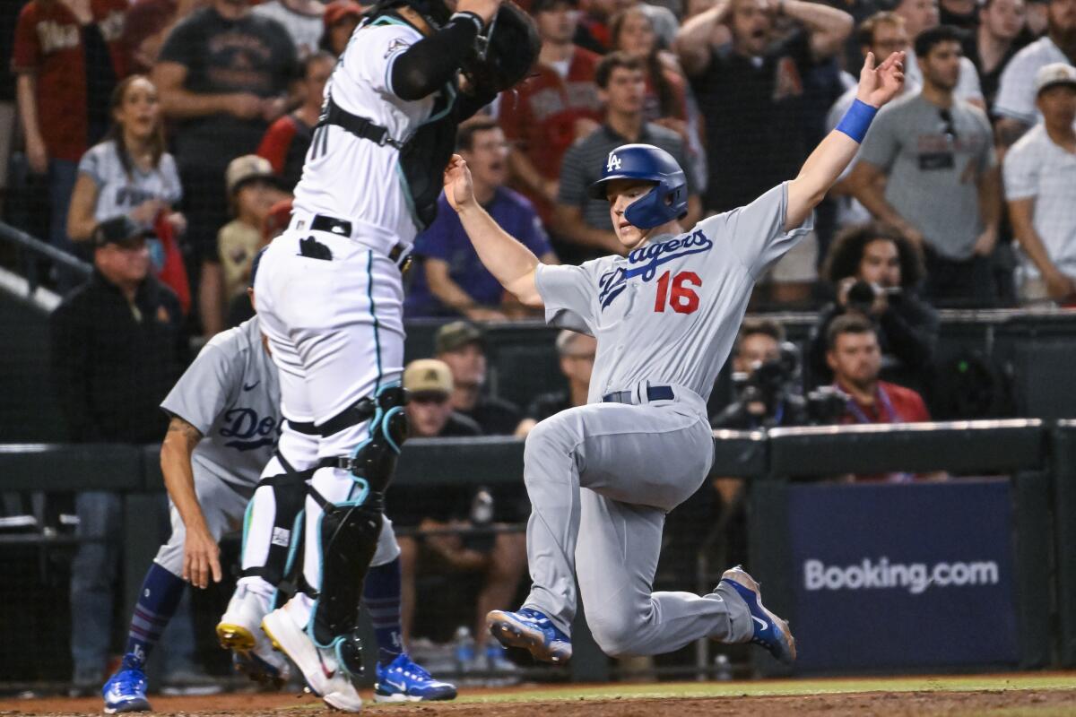 Dodgers' Will Smith scores a run during the seventh inning of Game 3 of the NLDS against the Diamondbacks.