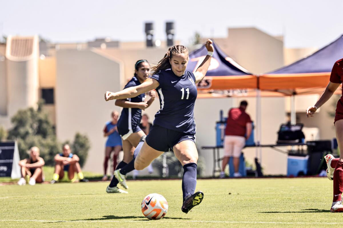 Tatum Wynalda winds up to kick the ball while competing for Pepperdine's soccer team.