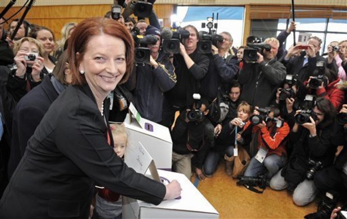 Australian Prime Minister Julia Gillard of the Federal Labor Party casts her vote at the Seabrook Primary School in Melbourne, Australia, Saturday, Aug. 21, 2010. (AP Photo/Mark Graham)