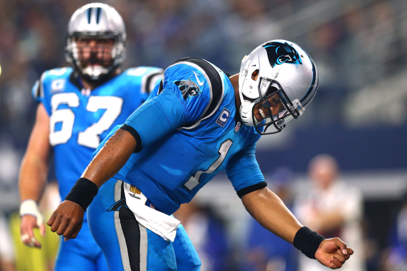 Carolina Panthers quarterback Cam Newton celebrates in front of center Ryan Kalil after scoring a touchdown.