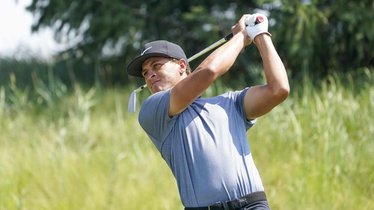 Cameron Champ hits a tee shot.