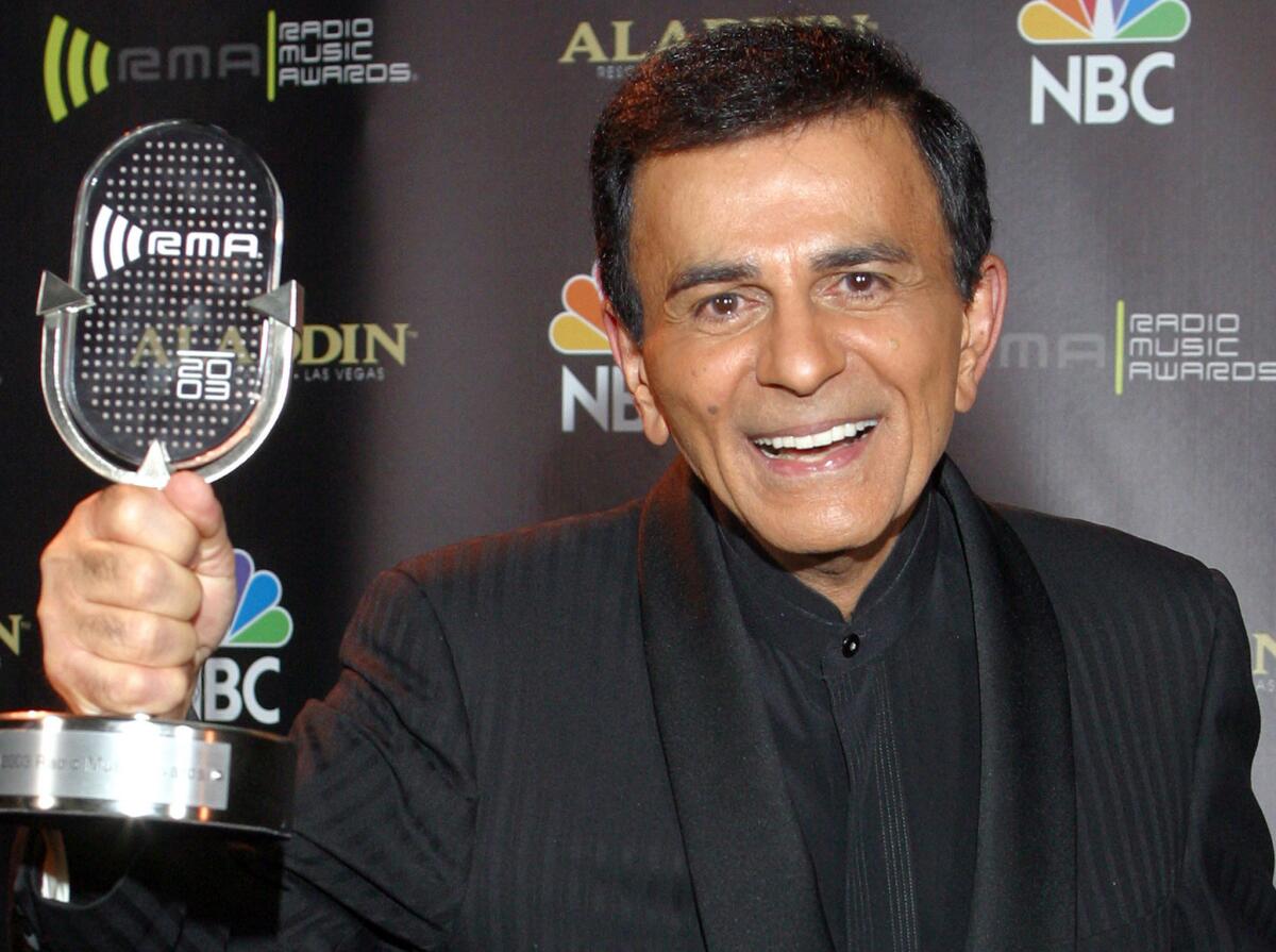 Casey Kasem poses for photographers after receiving the Radio Icon award during the 2003 Radio Music Awards. Kasem died Sunday at age 82.