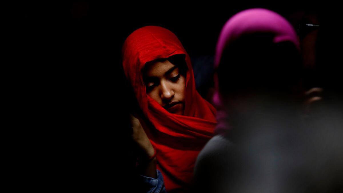 Lezeth Estrada stands in line at the Islamic Society of Orange County during a solidarity event recognizing World Hijab Day. (Francine Orr / Los Angeles Times)