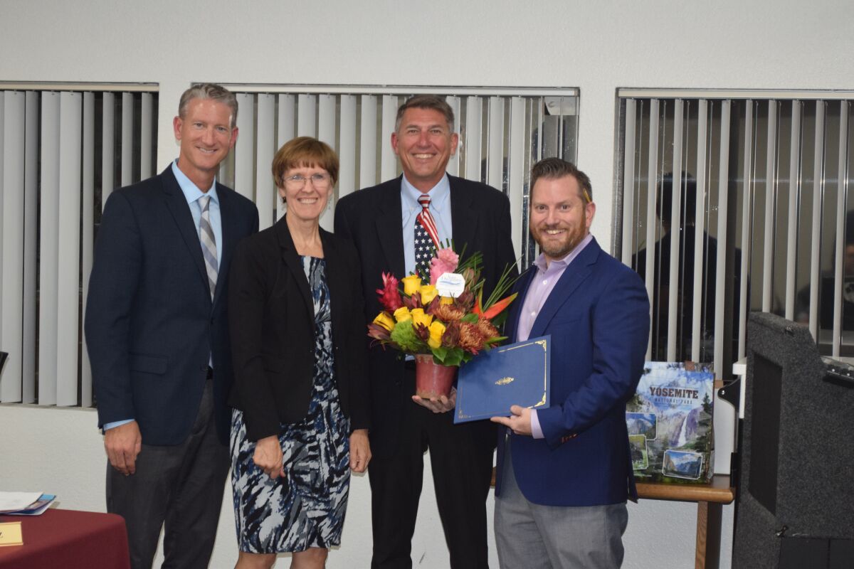 CCA math teacher Brian Shay with Principal Brett Killeen, San Dieguito Union School District board president Beth Hergesheimer and Superintendent Robert Haley.