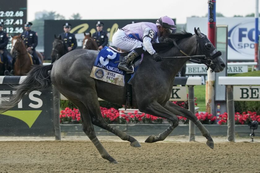 Arcangelo, with jockey Javier Castellano, crosses the finish line to win the Belmont Stakes horse race, Saturday, June 10, 2023, at Belmont Park in Elmont, N.Y. (AP Photo/Mary Altaffer)