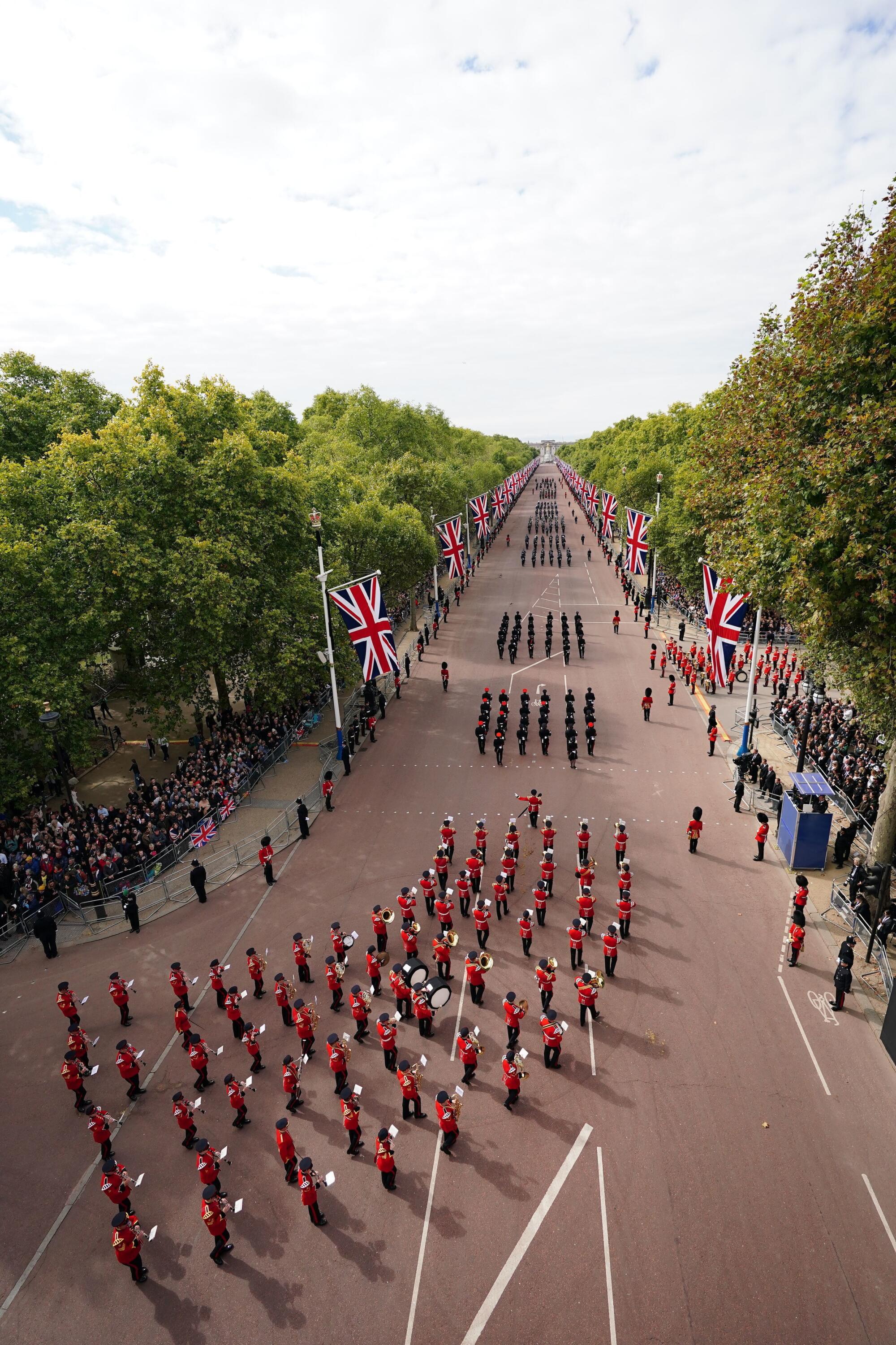 Members of a military marching band march down The Mall in central London on the day of Queen Elizabeth II's funeral.