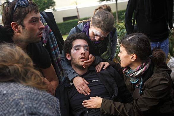 Rioting in Greece - collapsed student