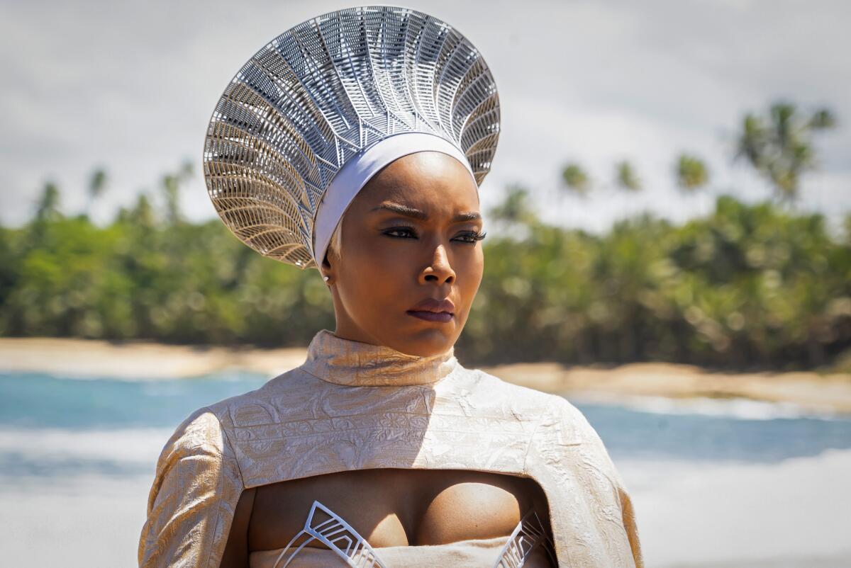 A woman in a regal silver headdress