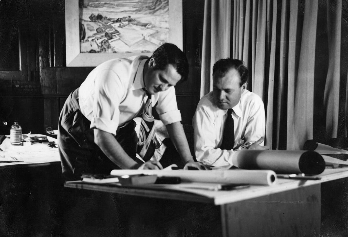 An undated photo of William F. Cody, left, with an associate in Cody's L.A. office on Santa Monica Boulevard. (Architecture and Design Museum)