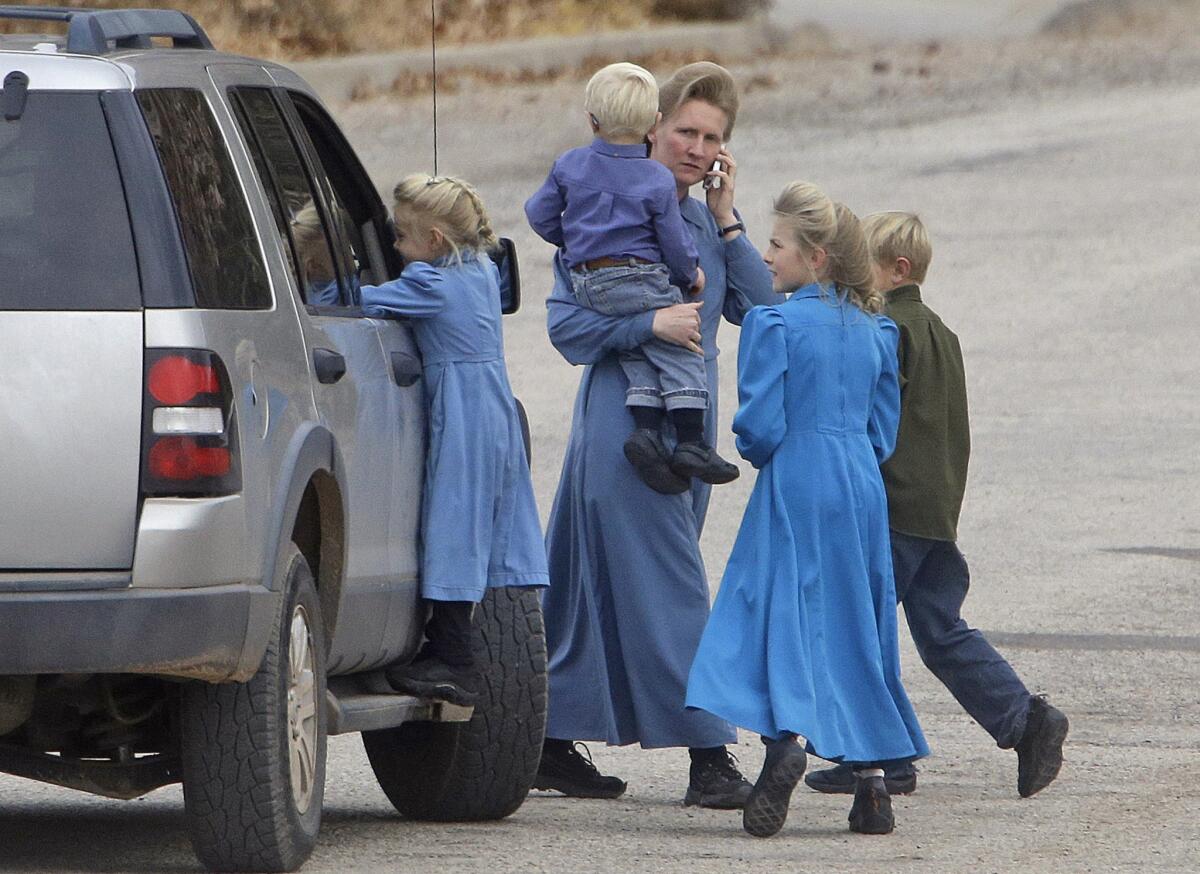 People walk along a street in 2014 in Hildale, Utah, a city once run by polygamist leader Warren Jeffs.
