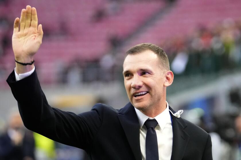 FILE - Former Milan player and coach of Ukraine national soccer team Andriy Shevchenko waves as he arrives for a semifinal first leg Champions League soccer match between AC Milan and Inter Milan at the San Siro stadium in Milan, Italy, Wednesday, May 10, 2023. President Volodymyr Zelenskyy has appointed former Ukrainian soccer great Andriy Shevchenko as a special adviser. (AP Photo/Luca Bruno, File)