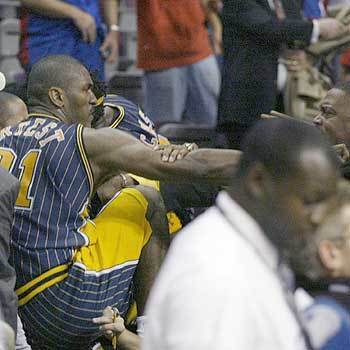Indiana Pacers forward Ron Artest gets into the stands to fight with some fans during a a brawl with the Detroit Pistons with just 45.9 seconds left in the game in Auburn Hills, Mich. The game was called by the officials.
