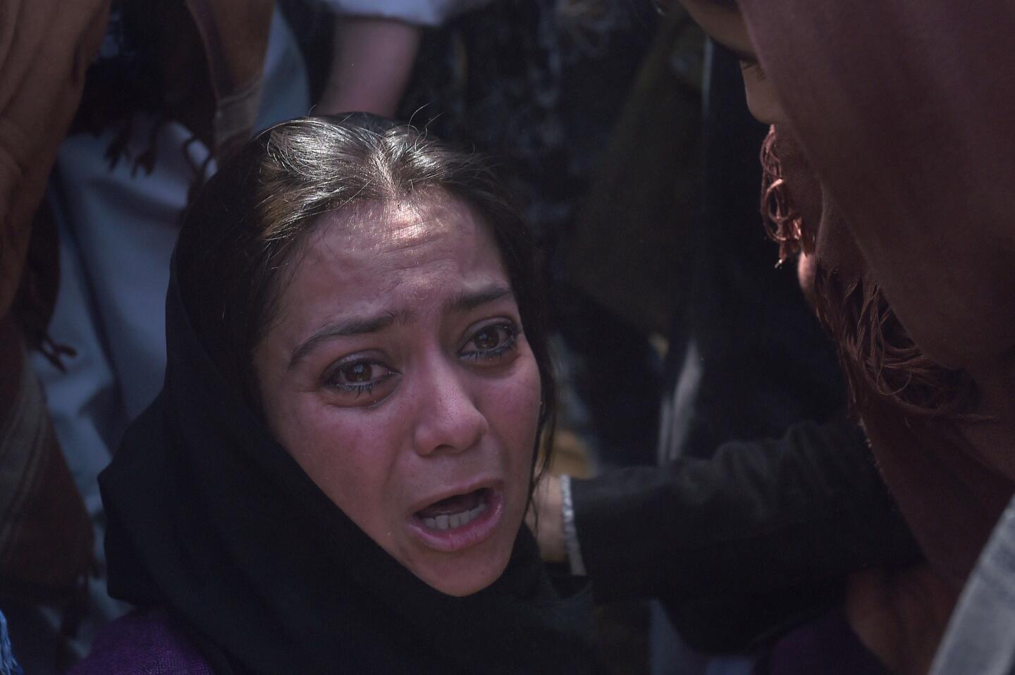 Afghan woman beaten by mob