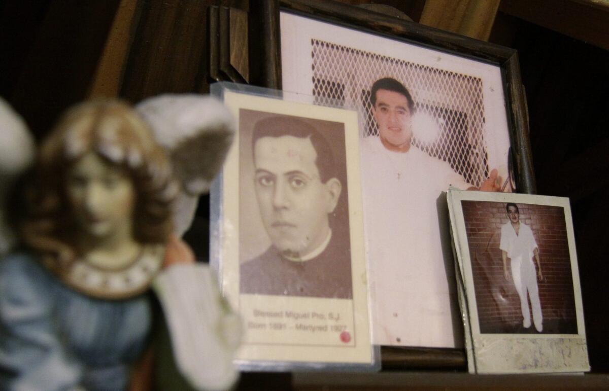 Images of Mexican inmate Edgar Tamayo are among other items on an altar in Cuernavaca, Morelos, Mexico.