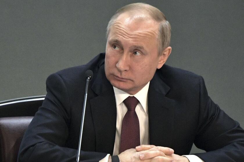 Russian President Vladimir Putin attends a meeting during a visit to the Interior Ministry in Moscow, Russia, Thursday, Feb. 28, 2019. Putin hailed the Russian police's performance and urged it to further strengthen efforts to combat extremism and drug-trafficking. (Alexei Nikolsky, Sputnik, Kremlin Pool Photo via AP)