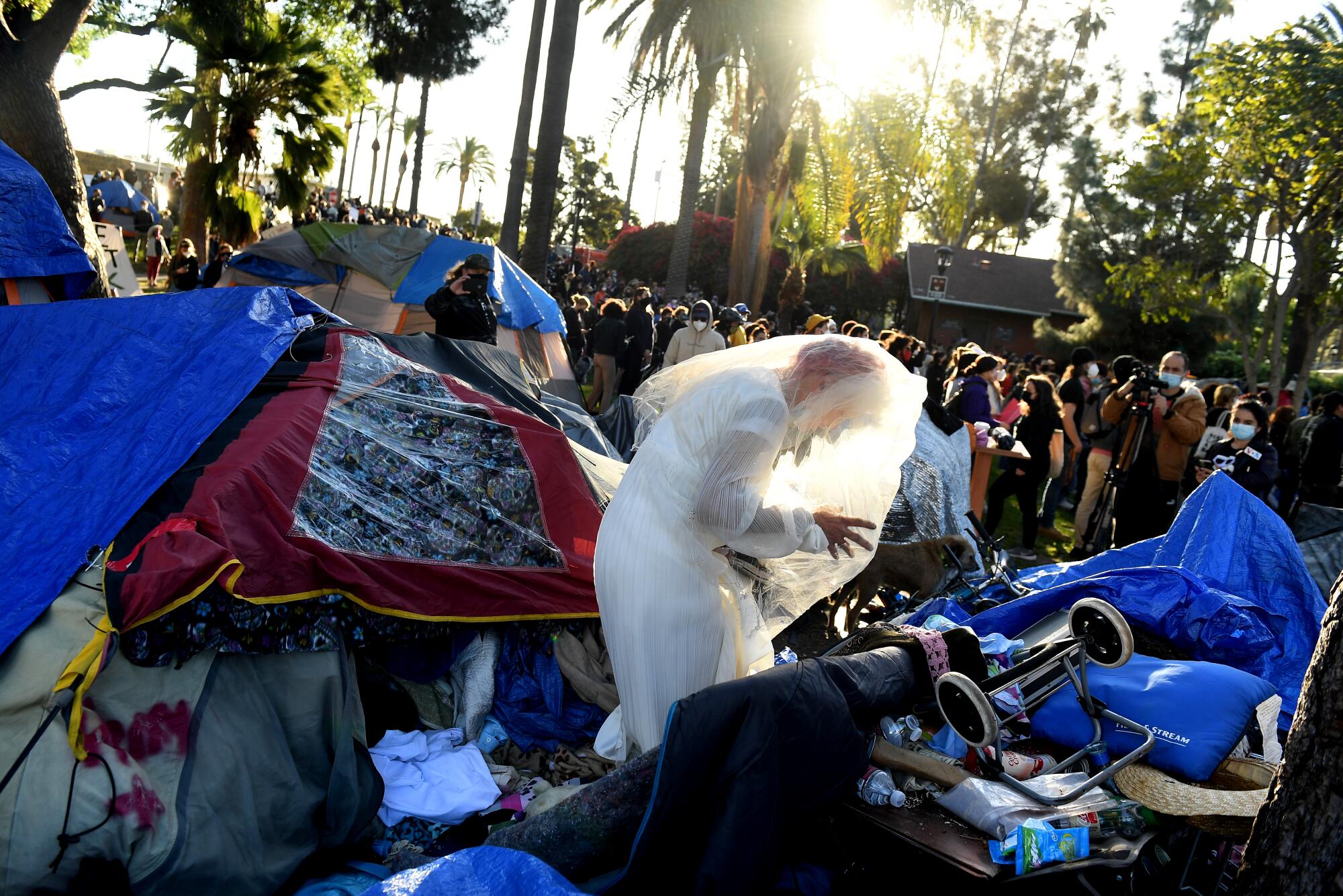 A person wears a wedding gown at a rally in Echo Park.
