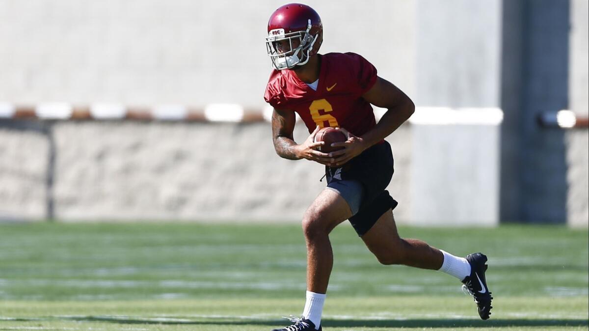USC wide receiver Michael Pittman Jr. carries the ball during drills as the Trojans open fall camp on Friday.