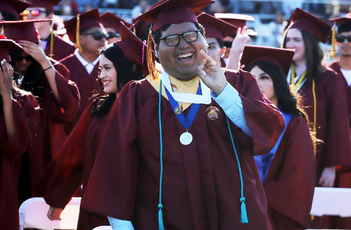 Jubilant graduates sing their alma mater for the last time during the Ocean View graduation ceremony on Wednesday.