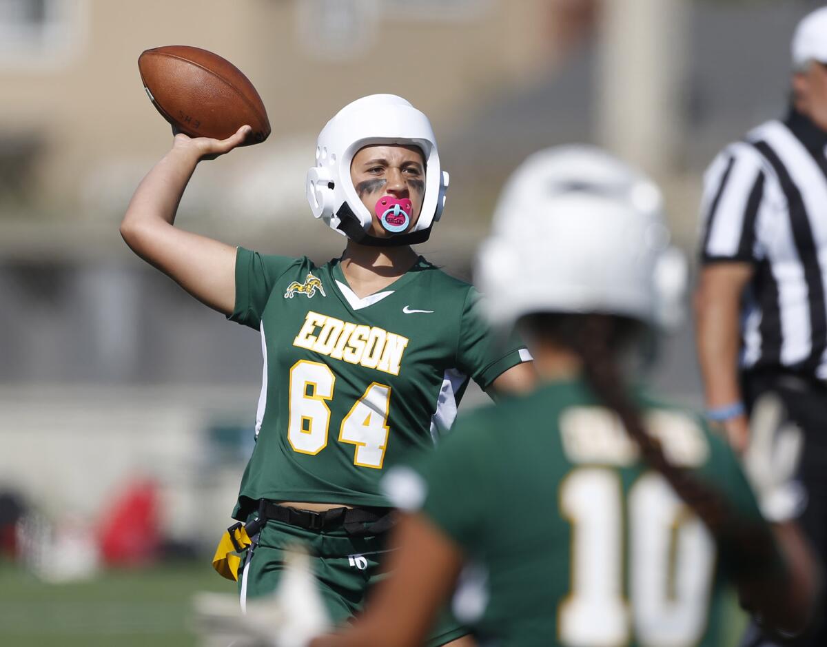 Edison quarterback Mia Cassel looks for a receiver during Wednesday's game against Huntington Beach.