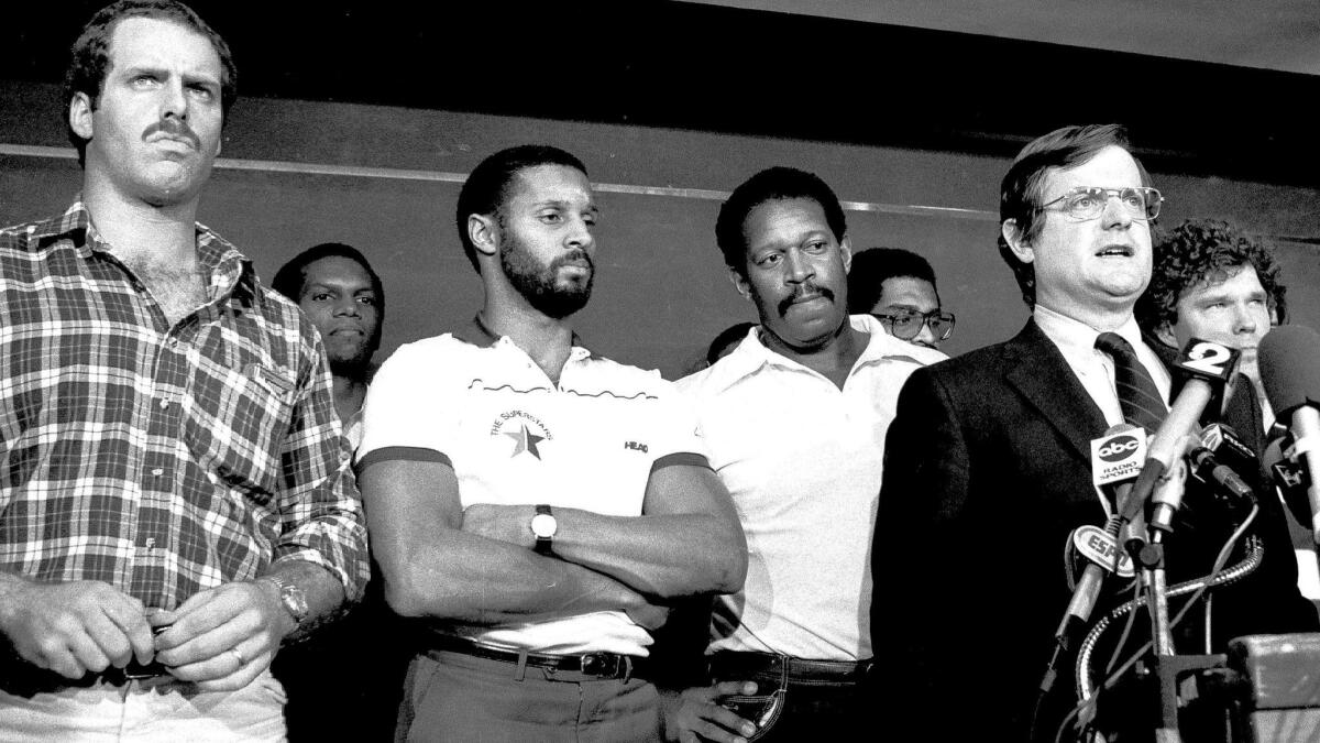 Labor lawyer Ed Garvey (at microphone). From left are Dave Stalls, Tampa Bay; Burgess Owens, Los Angeles Raiders; James Lofton, Green Bay Packers and Gene Upshaw, L.A. Raiders. To Garvey's right is Stan White, Detroit Lions.